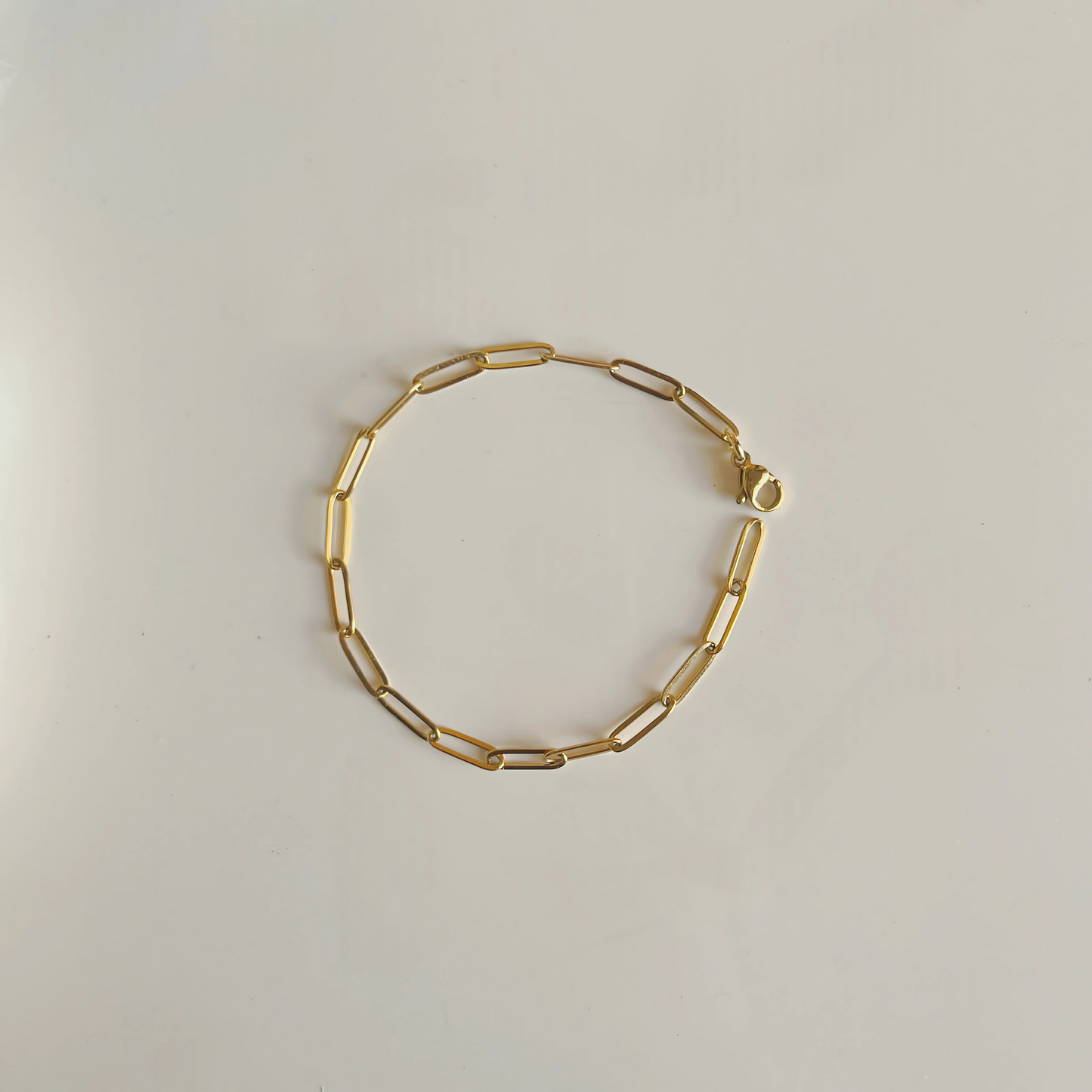 Paper clip multi charm bracelet